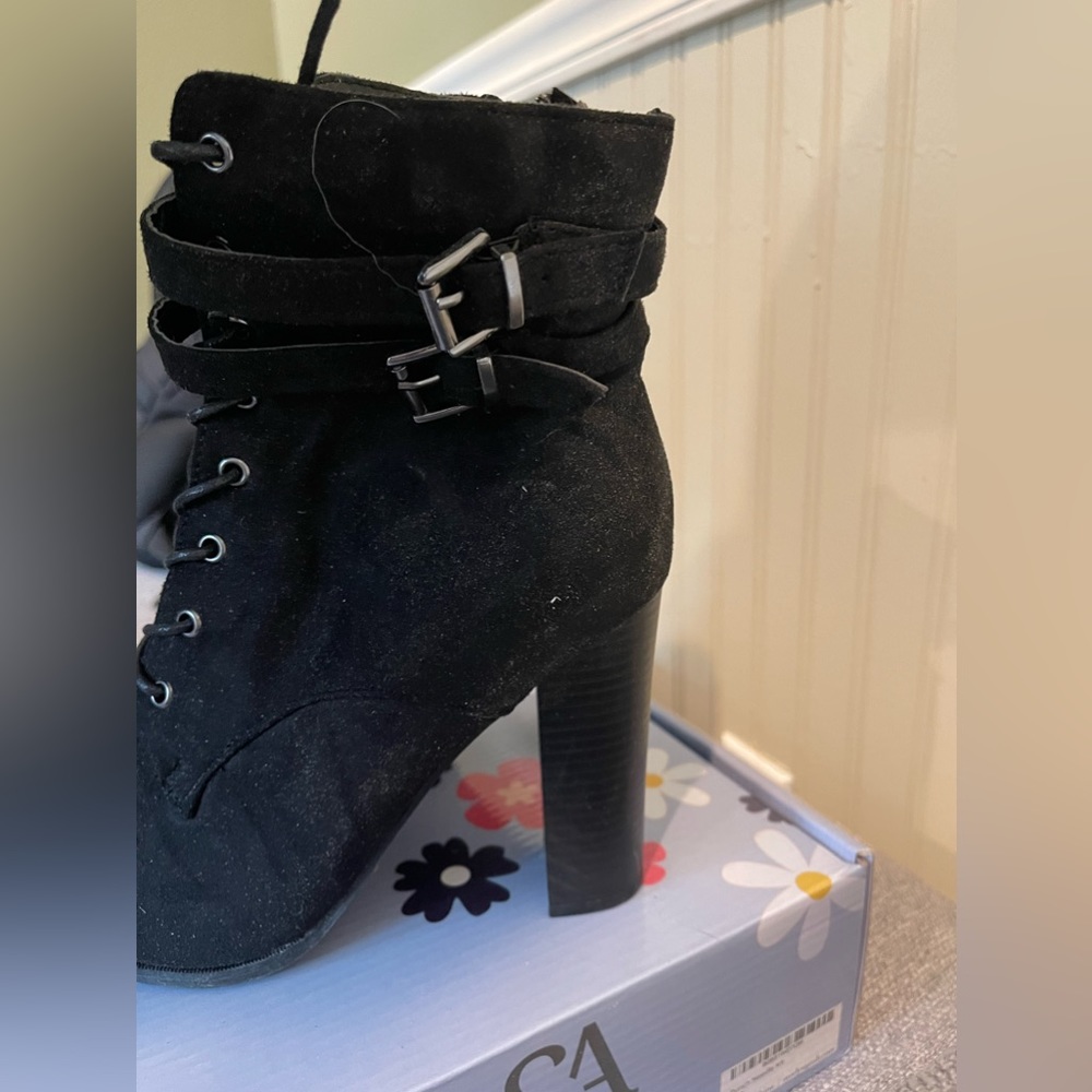 Black short lace up boot. Never worn. US size 8.5